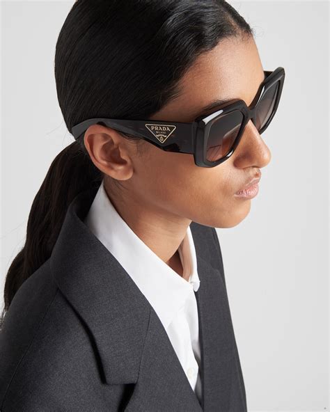 Sunglasses with the Prada logo .